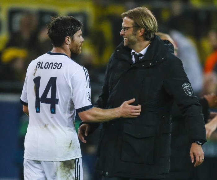 Jurgen Klopp (right) and Xabi Alonso pictured in 2012 following a Champions League game between Borussia Dortmund and Real Madrid